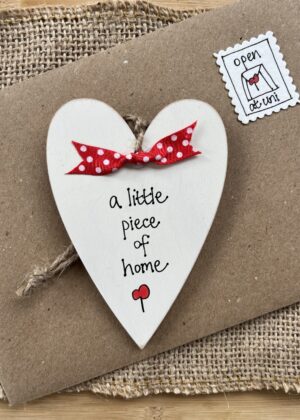 personalised wooden heart leaving home gift with 'a little piece of home' message
