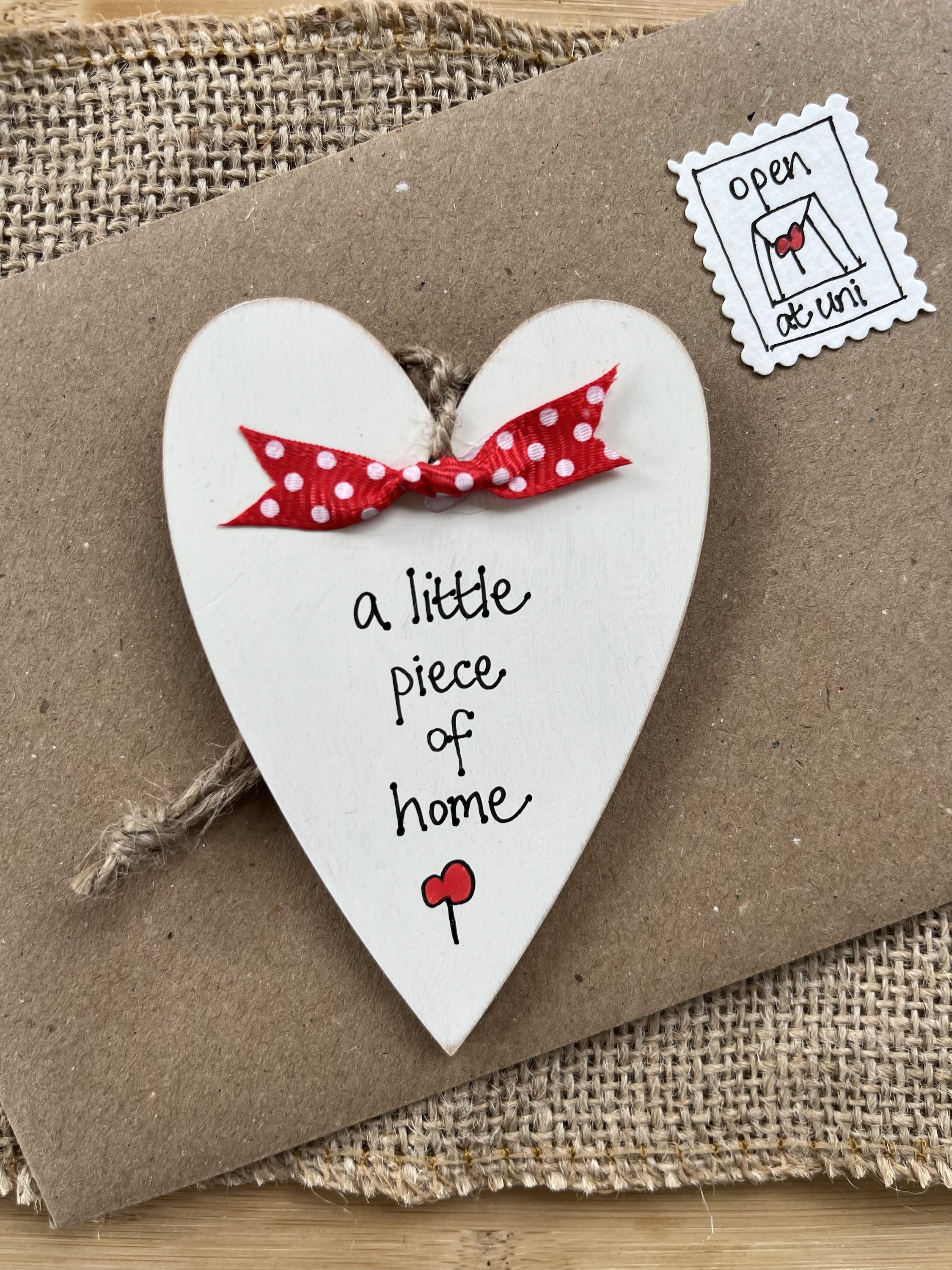 personalised wooden heart leaving home gift with 'a little piece of home' message